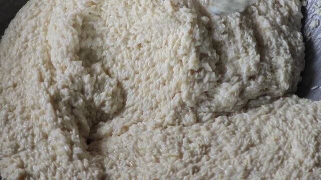 Cooking Sweet Coconut Milk with Sticky Rice for Sweet Thai Desert.
