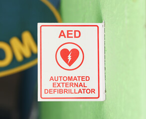 AED station sign in metallic green color plate, equipment using as medical treatment for heart attack incident.