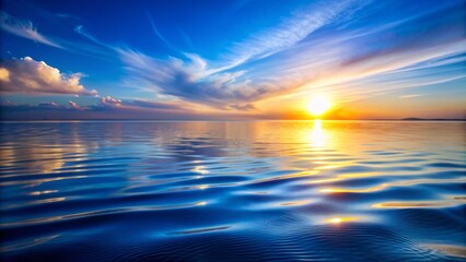 Obraz premium Serenely rippled water top surface reflecting vibrant blue sky with subtle wave patterns and gentle morning sunlight shimmering on horizon.