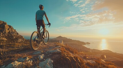 Male cyclist pausing on a hilltop, perfect for adventure and fitness themes.
