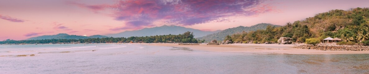 Naklejka premium Canacona, Goa, India. Sunny Sky Over Calm Water Of Arabian Sea. Natural Landscape With Sandy Palolem Beach At Sunny Summer Day With Blue Sky