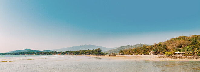 Canacona, Goa, India. Sunny Sky Over Calm Water Of Arabian Sea. Natural Landscape With Sandy Palolem Beach At Sunny Summer Day With Blue Sky