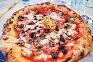 Italian capricciosa  pizza with artichokes  .Close up 