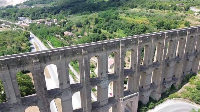 A spectacular aerial view with drones of the Vanvitelli aqueduct built in 1762 near Caserta in the summer lights 6