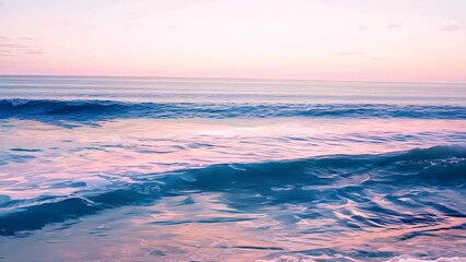Obraz premium Calm ocean waves at sunset with pink