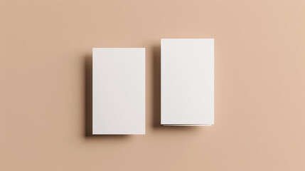 Minimalist presentation of two vertical blank business cards mockup for design template, top view. White business card mockup front and back with natural colors. Branding concept � insert your logo.