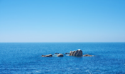 Ocean, rocks and horizon in outdoor location, travel and peace in environment on sea vacation. Water, stone and calm beach on weekend trip, tropical island and holiday wallpaper of Caribbean skyline