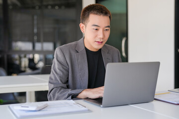 Business man working using laptop computer Hands typing keyboard. Professional investor working start up project. business planning in office. Technology business