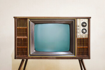 Front view of retro old TV with blank screen standing  in the room, vintage television, antique...
