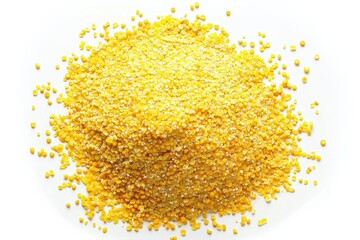 A pile of corn kernels on a white surface