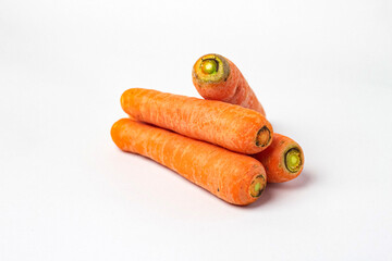 Fresh unpeeled organic carrot, isolated on white background.