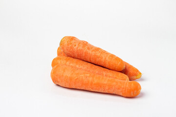 Fresh unpeeled organic carrot, isolated on white background.