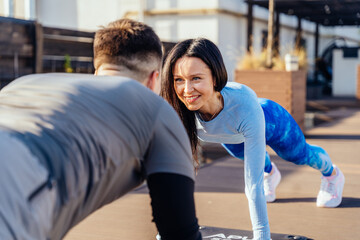 Sporty athletic couple exercising together