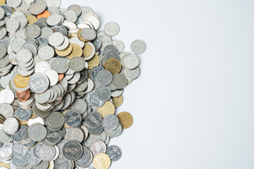 A large number of coins are flowing from the left