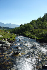 Valley of the mountain river Malaya Dukka in the mountains of the North Caucasus. Tourist trail to the lakes in the mountains of the Arkhyz resort, Karachay-Cherkessia, Russia © Oksana