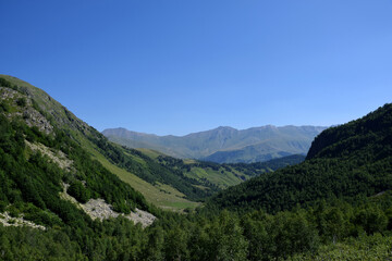 Valley of the mountain river Malaya Dukka in the mountains of the North Caucasus. Tourist trail to the lakes in the mountains of the Arkhyz resort, Karachay-Cherkessia, Russia © Oksana