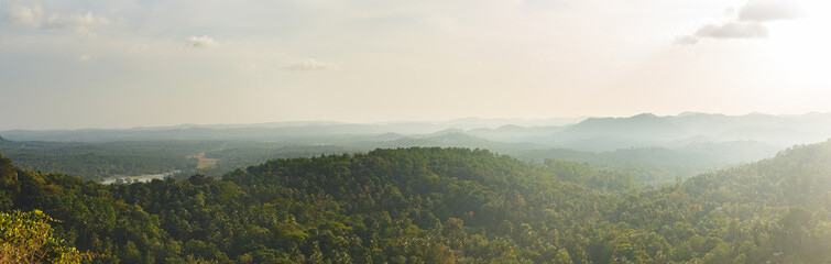Aerial panoramic view of hazy sunset over lush primary forest Sri Lanka.Top view landscape of...
