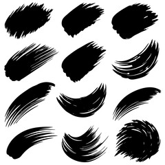 Fototapeta premium A collection of black brush strokes set against a plain white background