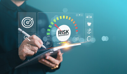 Risk assessment management concept, financial business plan process service. Businessman use pen tablet on low-high risk speedometer icon screen. Investment control technology, forecast evaluation