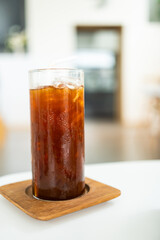 Ice cold black coffee with ice. Cold summer drink at cafe