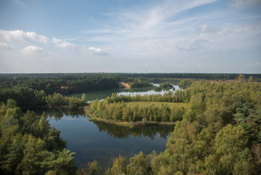 View from an open-air observation tower of a landscape with a beautiful lake in the Lommel-Sahara Nature Park in Belgium