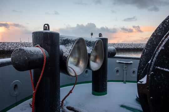 Bollar on tug boat covered with snow. Close up of bollar on north sea tug