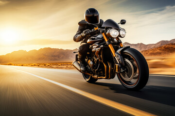 Motorcyclist riding fast on empty desert road