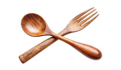 Wooden spoon and fork crossed on a surface isolated on a transparent background