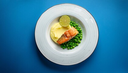A fine dining dish of fried fish, peas and potato puree with lime, top view, blue background, generative AI