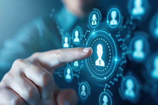 Connecting the Dots: A hand reaches out to touch a digital profile icon, symbolizing the power of human connection in a network of interconnected individuals.  The image evokes a sense of collaboratio
