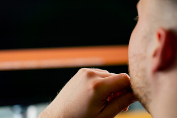 Close-up of man's head behind the monitor screen editing software is included, editing story dashboard, professional software for cinema and advertising