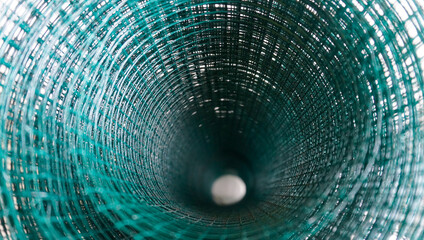 circular pattern formed by rolls of green PVC pendant wire