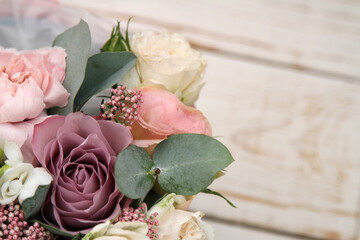 Bouquet of fresh flowers on the wooden background 