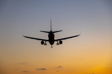 Flight landing at sunset
