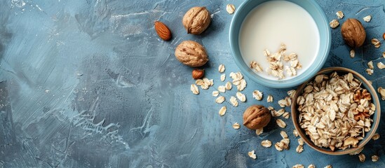 Nutritious morning meal comprising milk nuts and muesli ready to be consumed with copy space image