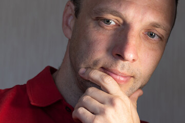 Fototapeta premium Face portrait of positive young adult Caucasian man, close up