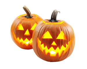 Fototapeta premium Two pumpkins with glowing eyes and mouths. One is smiling and the other is frowning. Scene is spooky and eerie