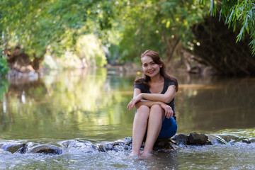 Portrait of a woman relaxing in the river.