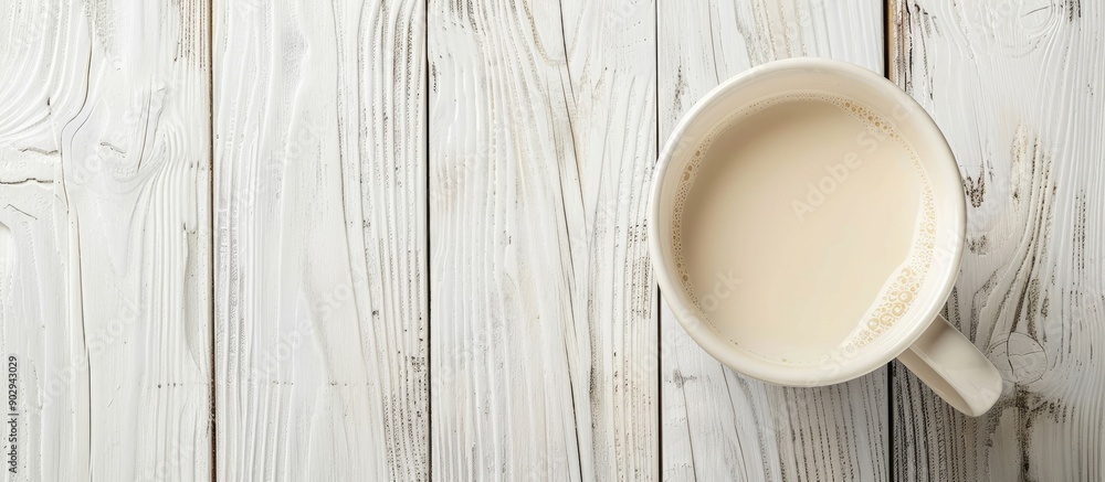 Poster white wooden table background with a mug of milk suitable for any copy space image