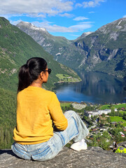 Naklejka premium Serene Reflection Over Norwegian Fjord at Midday, Geiranger fjord Norway