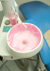 Dental sink. Dentist preparing for patient appointment