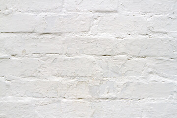 Light plaster texture on a brick wall.