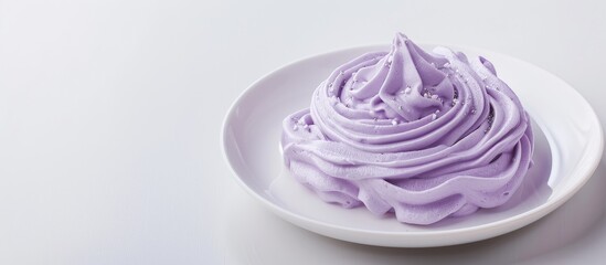 Fototapeta premium Purple sweet potato wafer cream on a white plate with copy space image on a white background