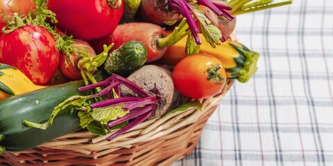 Harvest of autumn vegetables in a wicker basket. Urban farm produce, healthy ingredient