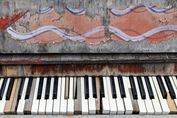 A piano with a graffiti design on it