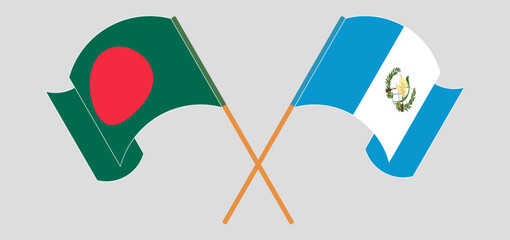 Crossed and waving flags of Bangladesh and Republic of Guatemala