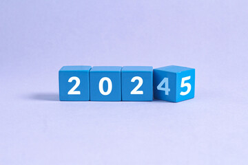 New year 2025 concept on white cubes with gray background 