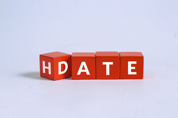 Date and hate words on cubes with gray background.