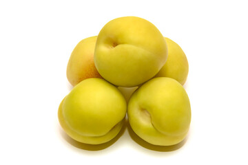 Many green nectarines, sweet juicy summer fruit. On white background.