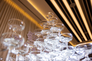 A stack of champagne glasses with a white background